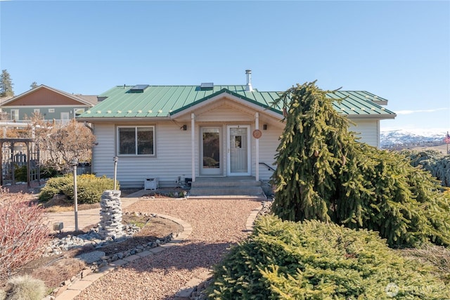 view of front of house with a standing seam roof and metal roof