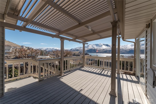 wooden terrace featuring a mountain view and a pergola