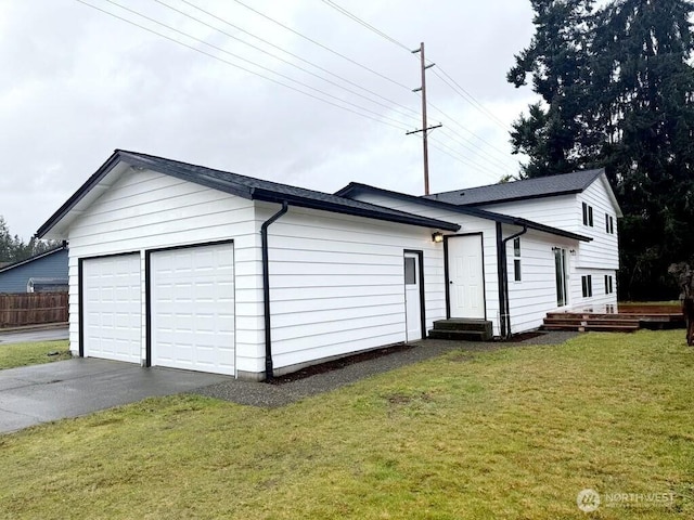 exterior space with entry steps and a lawn