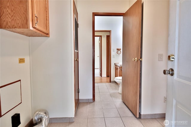 hallway featuring light tile patterned floors