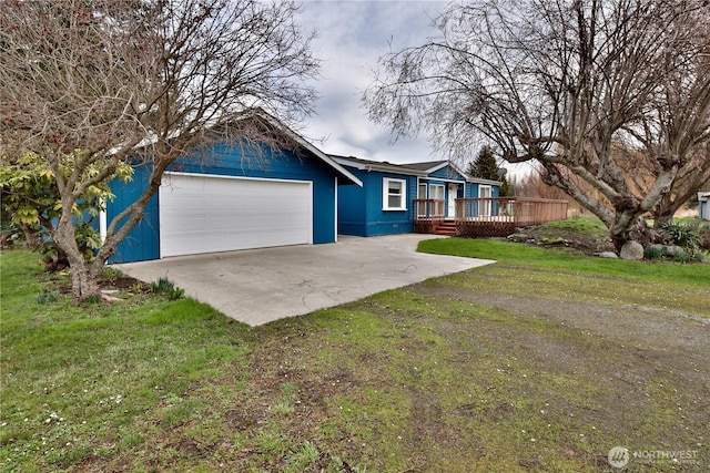 ranch-style home with a wooden deck, a garage, concrete driveway, and a front lawn