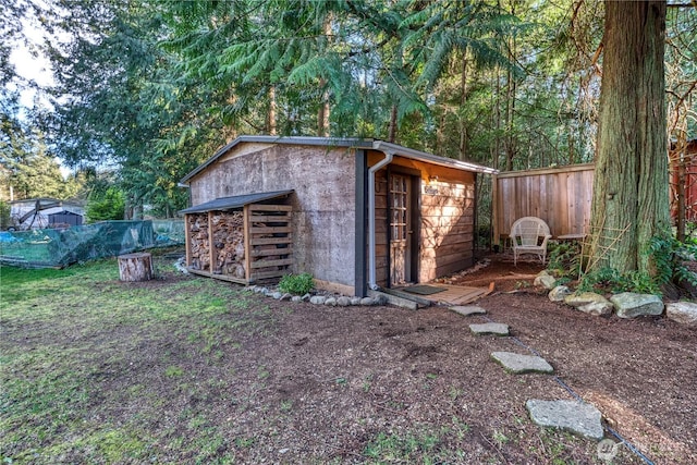 view of outdoor structure with an outdoor structure and fence