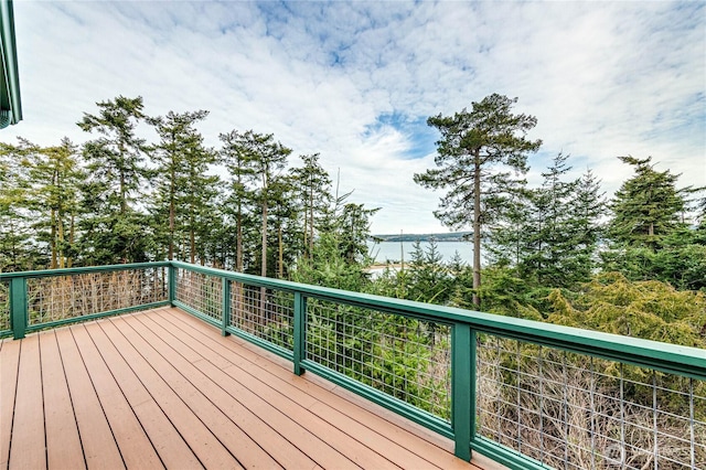 wooden deck featuring a water view