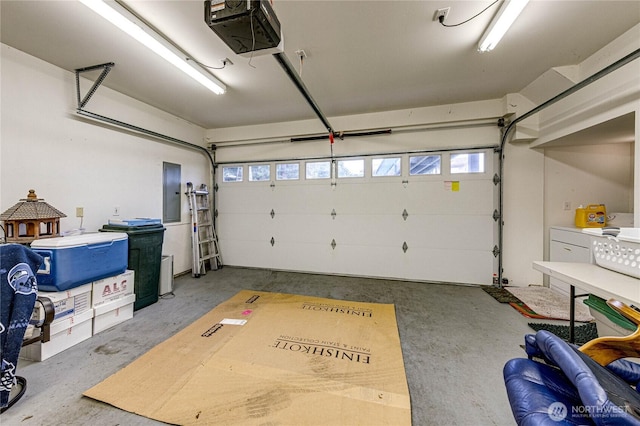 garage featuring a garage door opener and electric panel