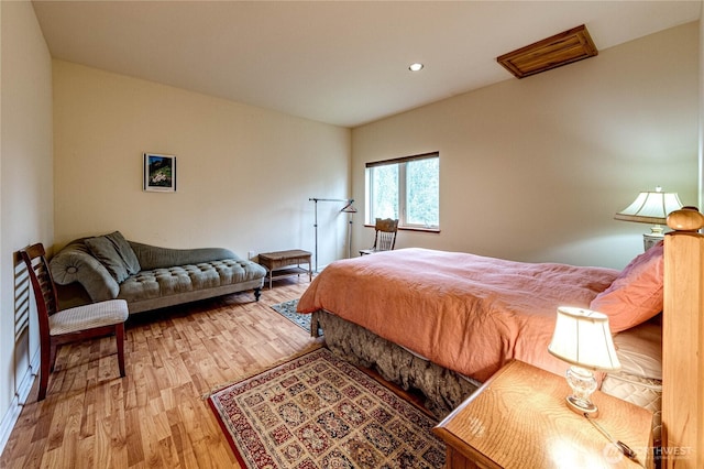 bedroom featuring wood finished floors and recessed lighting