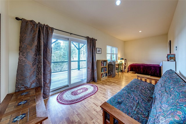 bedroom with wood finished floors and recessed lighting