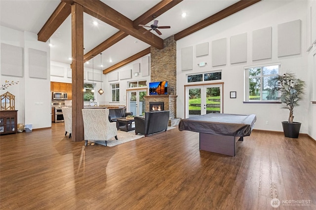 rec room with high vaulted ceiling, a fireplace, french doors, beam ceiling, and dark wood-style floors