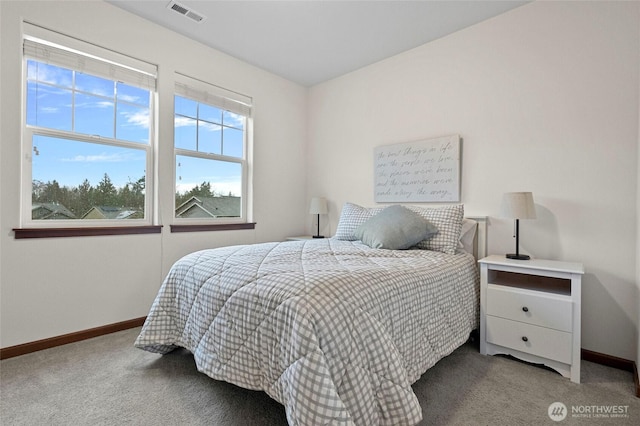 bedroom with baseboards, visible vents, and carpet flooring