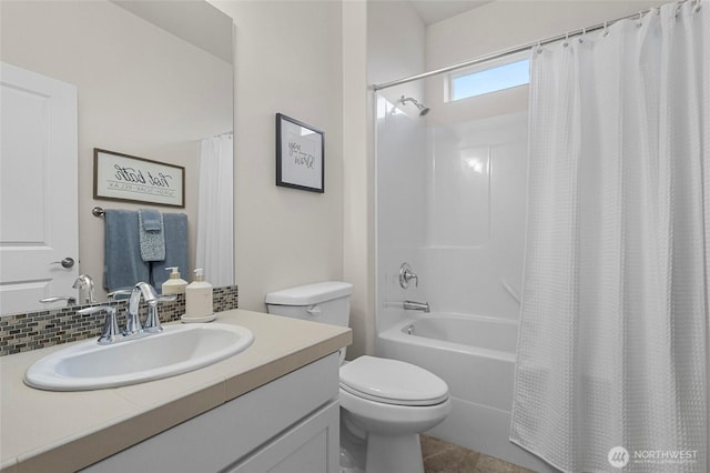 full bathroom featuring shower / bath combo, vanity, and toilet