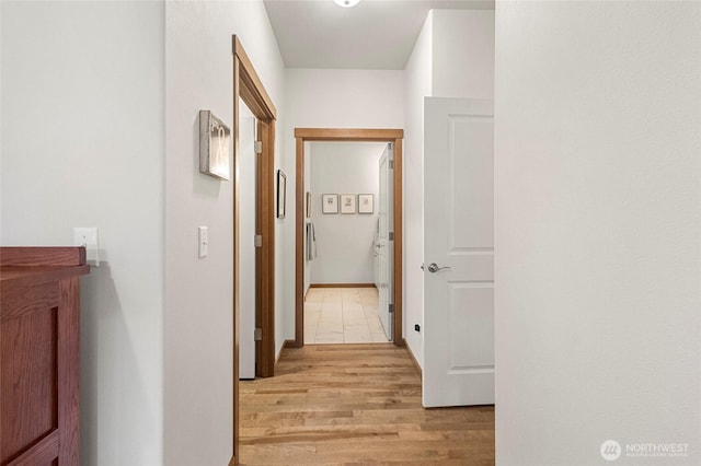 corridor featuring light wood-style flooring