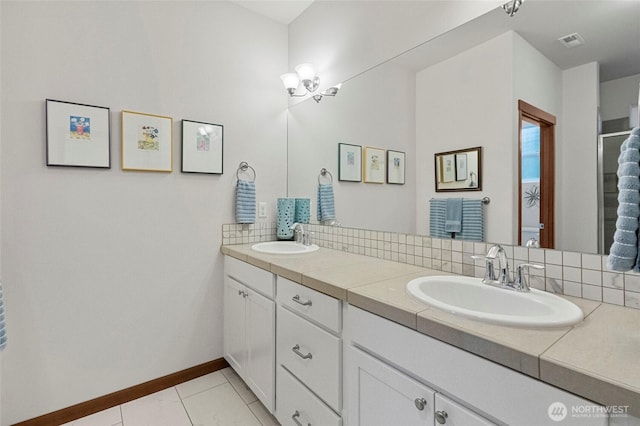 bathroom featuring double vanity, visible vents, decorative backsplash, and a sink