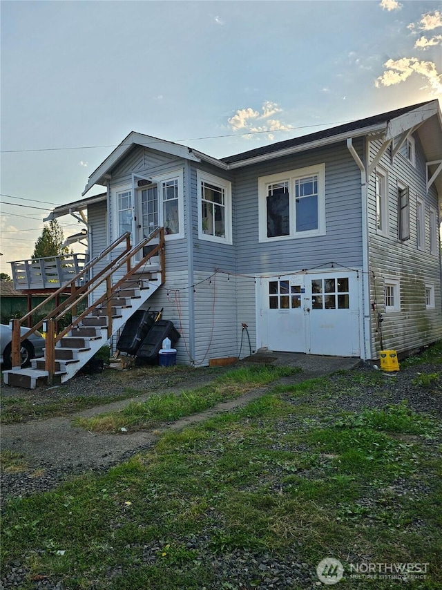 view of front of house featuring stairway