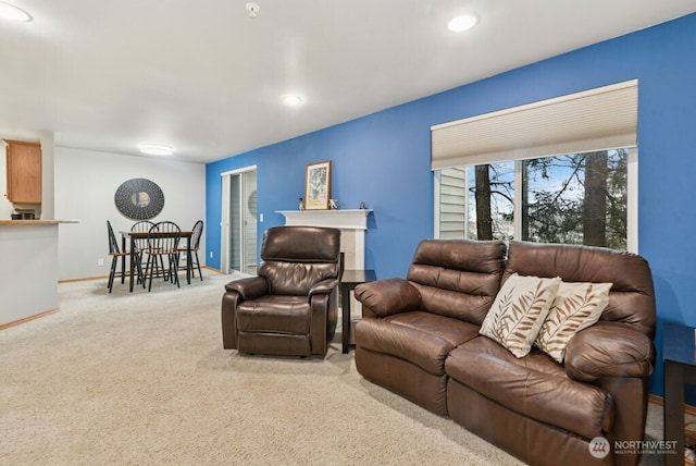 carpeted living room with recessed lighting and baseboards