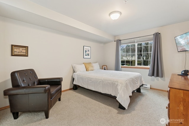 carpeted bedroom featuring baseboards