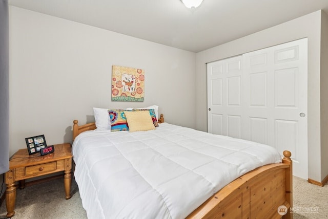 carpeted bedroom featuring a closet