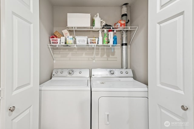 clothes washing area featuring laundry area and independent washer and dryer