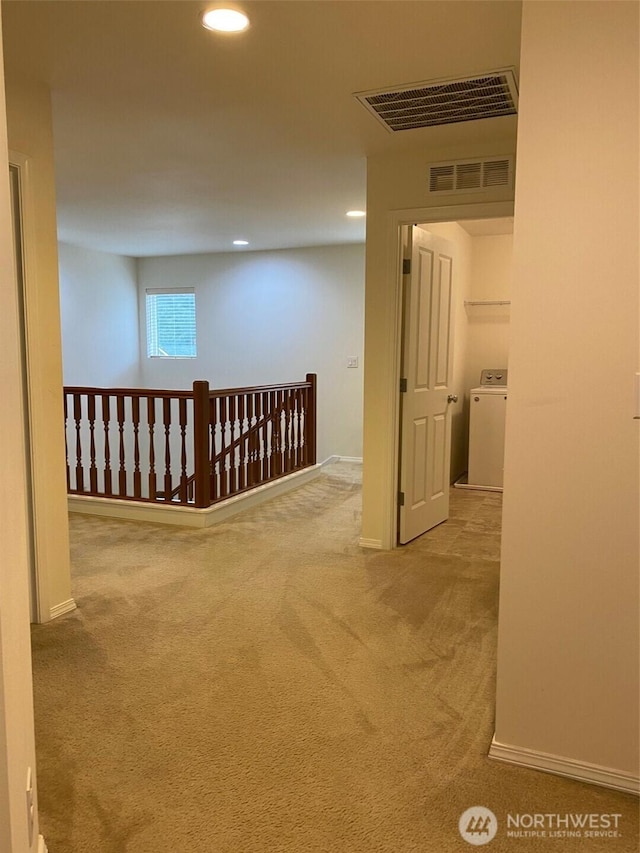 hall with carpet, visible vents, washer / clothes dryer, and recessed lighting