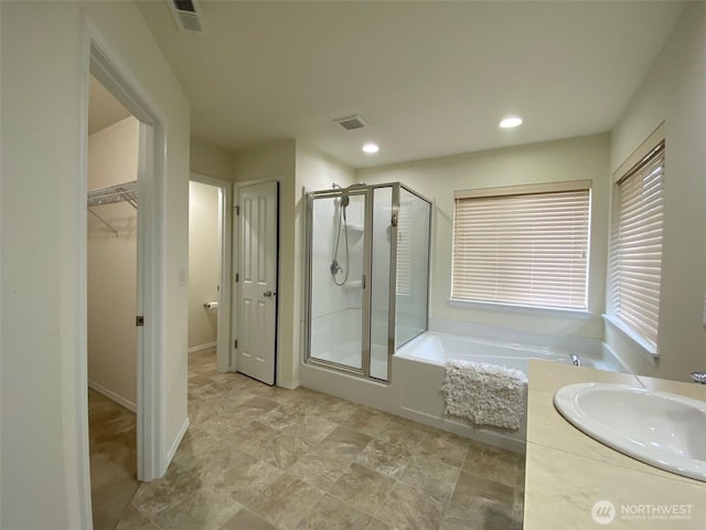 bathroom featuring recessed lighting, visible vents, a garden tub, and a shower stall