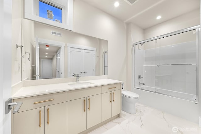 full bath featuring marble finish floor, shower / bath combination with glass door, visible vents, toilet, and vanity