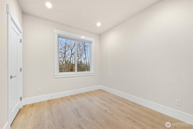 spare room with light wood-style floors, recessed lighting, and baseboards