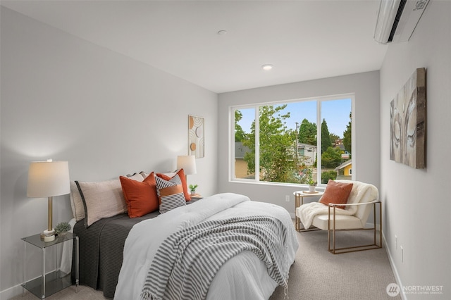 carpeted bedroom featuring a wall unit AC and baseboards