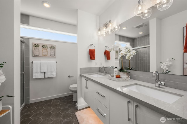 full bath featuring visible vents, a sink, and toilet