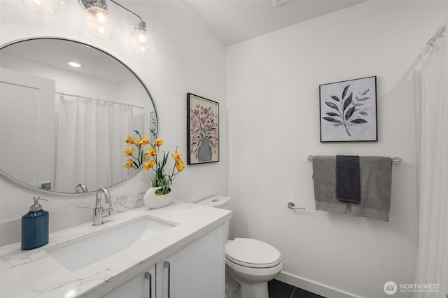 full bathroom featuring toilet and vanity