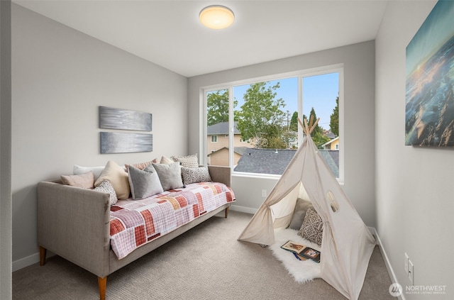 carpeted bedroom featuring baseboards