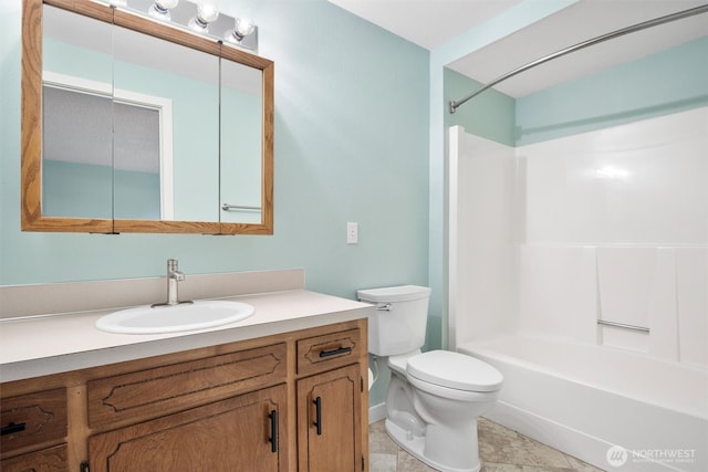 full bathroom with  shower combination, vanity, and toilet