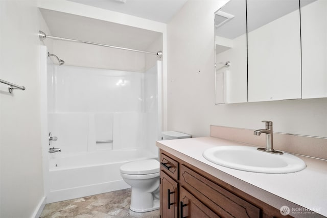 bathroom featuring toilet, bathtub / shower combination, and vanity