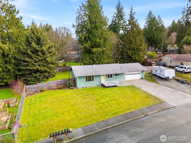 single story home with driveway, an attached garage, crawl space, fence, and a front lawn