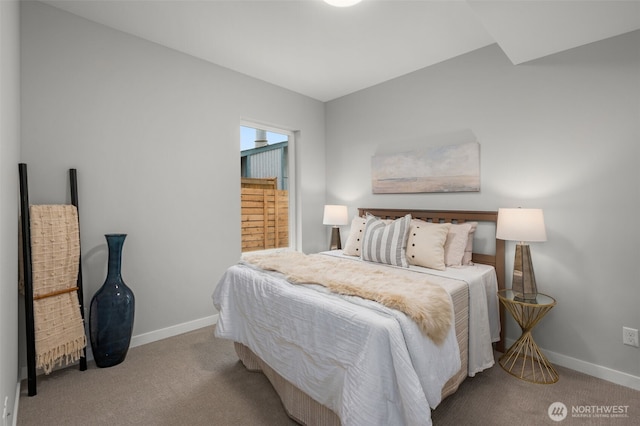 bedroom featuring baseboards and light colored carpet