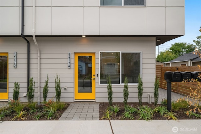 property entrance with fence