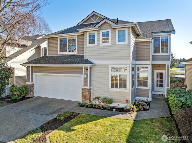 view of front of house featuring a garage, concrete driveway, and roof with shingles