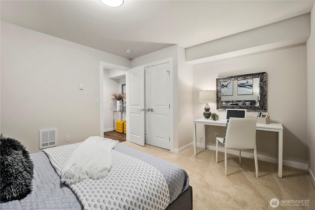 bedroom featuring baseboards and visible vents