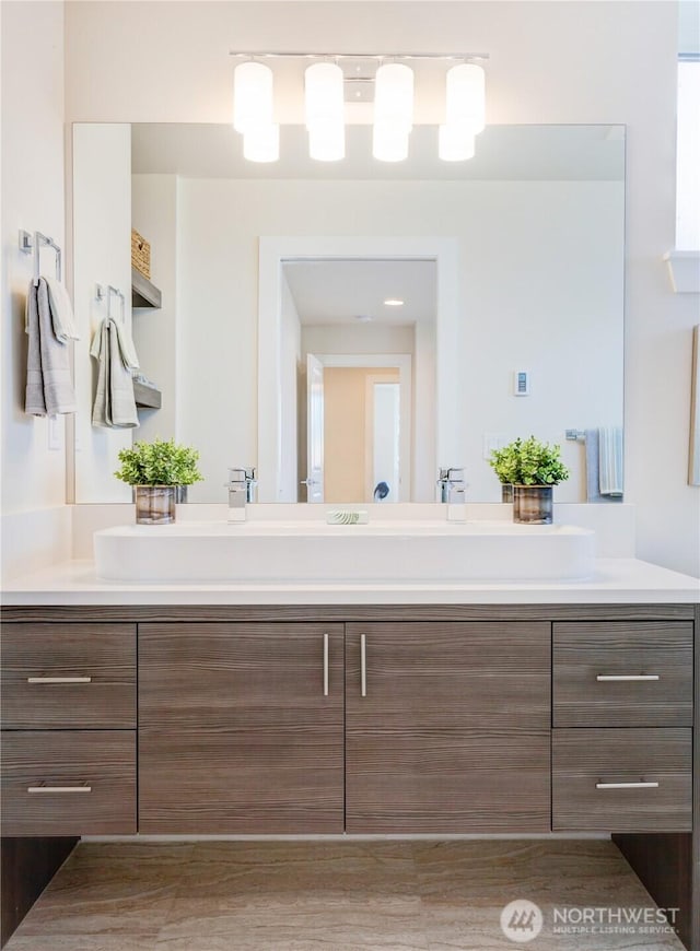 bathroom featuring double vanity