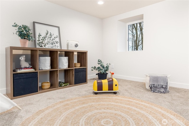 living area with recessed lighting, baseboards, and carpet flooring