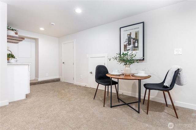 dining area featuring recessed lighting, baseboards, and light carpet