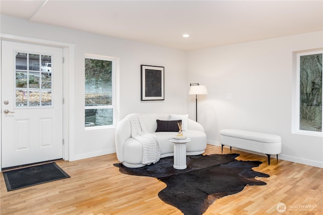 sitting room with recessed lighting, baseboards, and light wood finished floors