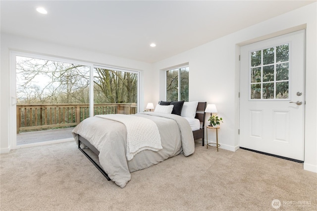 carpeted bedroom featuring recessed lighting and baseboards