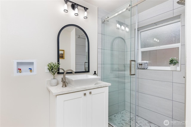 full bathroom with vanity and a stall shower