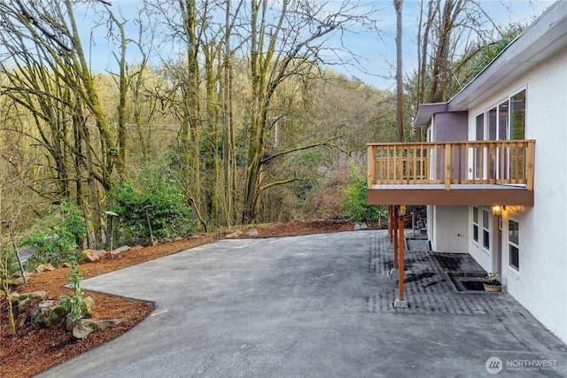 view of patio / terrace with a view of trees