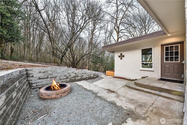 view of patio featuring a fire pit