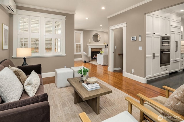 2311 42nd Ave E, Seattle, WA 98112 - living area featuring baseboards, ornamental molding, recessed lighting, dark wood-style floors, and a wall mounted AC