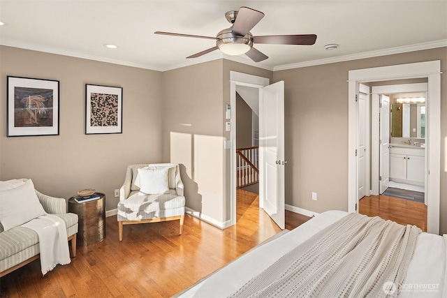 2311 42nd Ave E, Seattle, WA 98112 - bedroom with a sink, baseboards, wood finished floors, and ornamental molding
