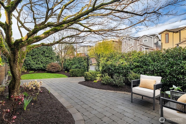 2311 42nd Ave E, Seattle, WA 98112 - view of patio / terrace featuring a gate, fence, and a residential view