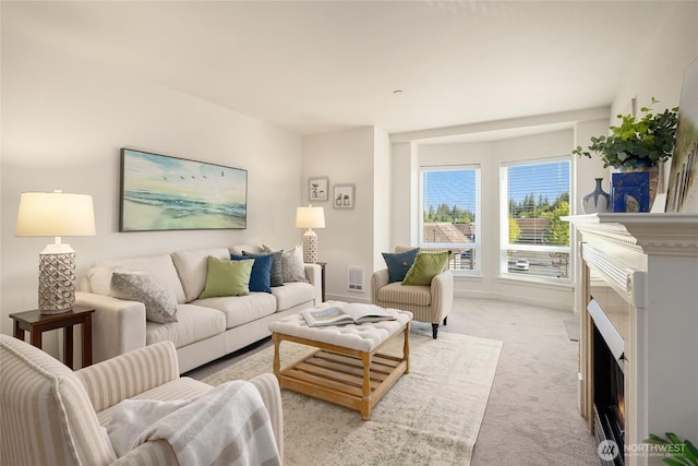 living room featuring a warm lit fireplace, light carpet, visible vents, and baseboards