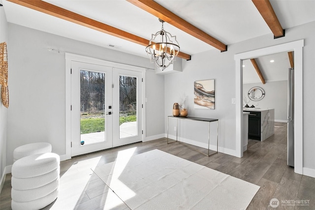 doorway featuring beam ceiling, french doors, baseboards, and wood finished floors