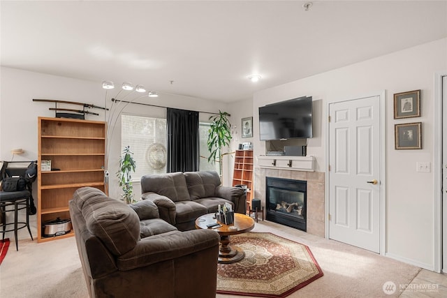 living area with light carpet, a fireplace, and baseboards