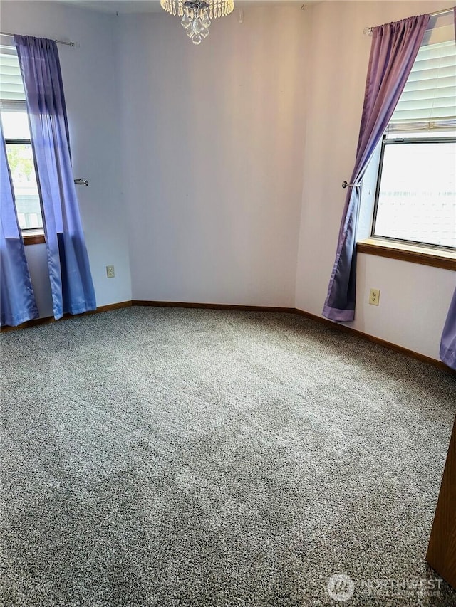 651 SE Bayshore Dr Unit B304, Oak Harbor, WA 98277 - spare room with plenty of natural light, carpet flooring, and a chandelier